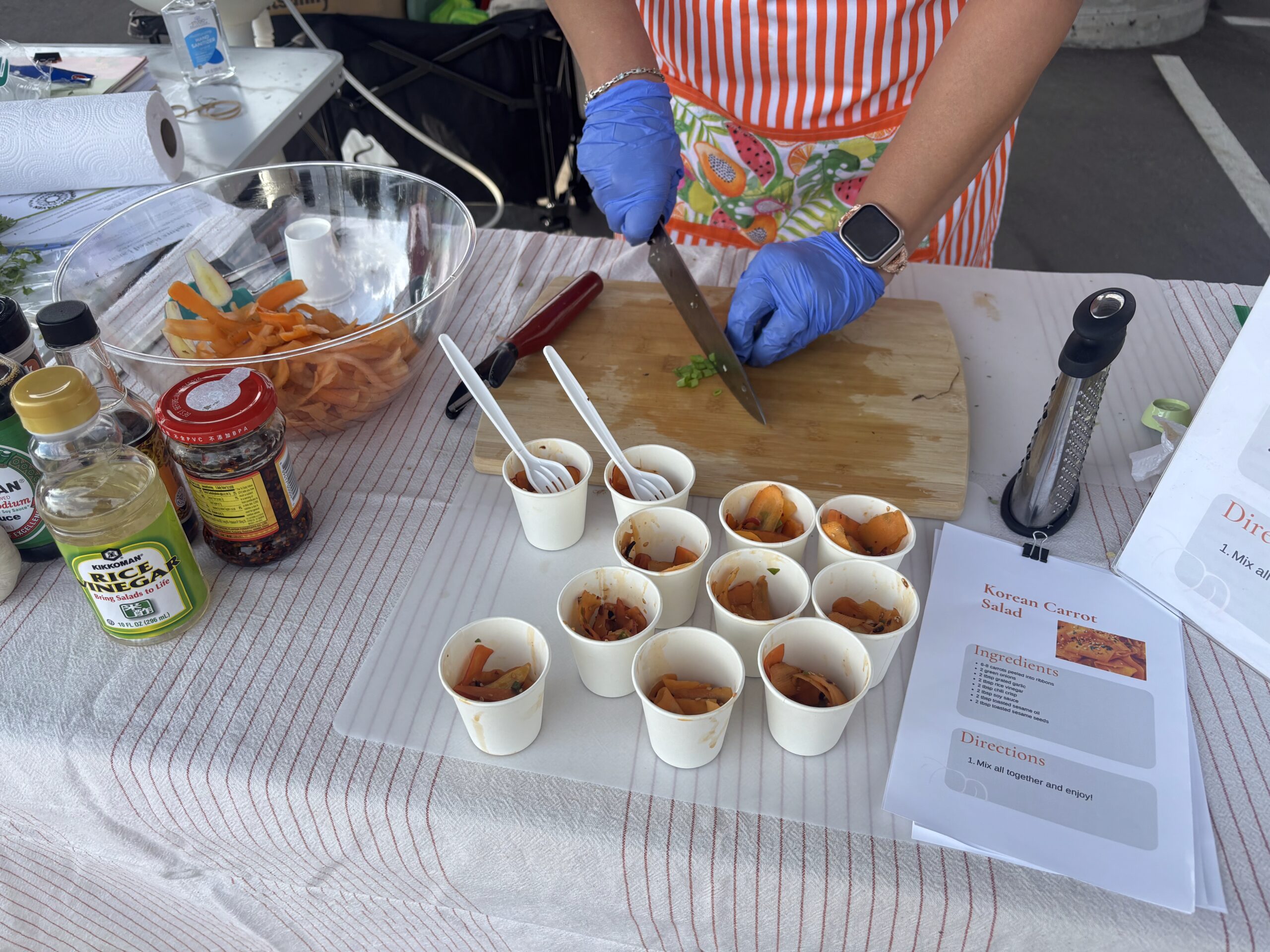 Leah Derrera at the Pueblo's Eastside Market makes Korean carrot salad.
