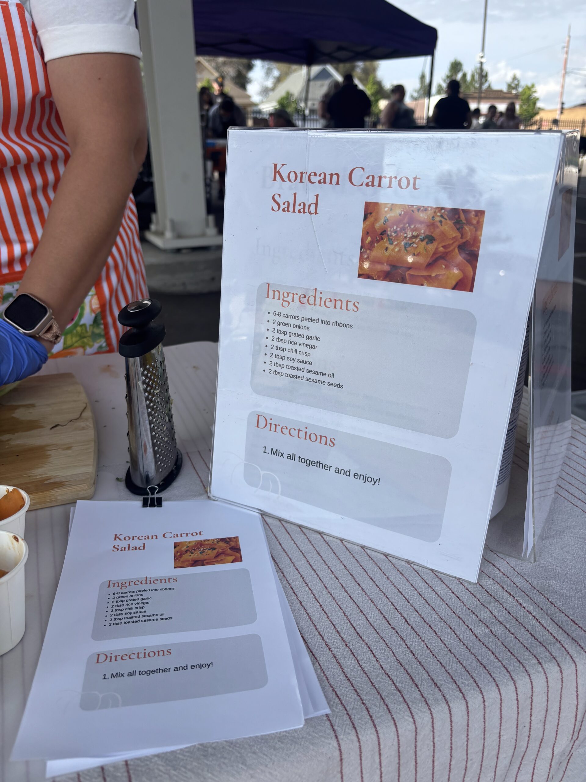 Leah Derrera at the Pueblo's Eastside Market makes Korean carrot salad.