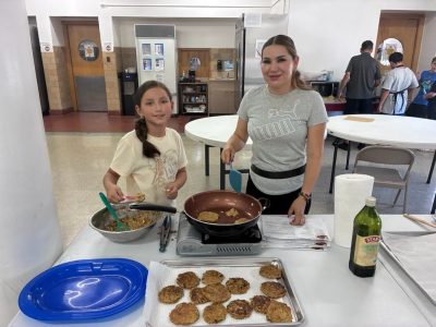 Cooking with veggies in Pueblo Food Project's intergenerational Nourishing Connections program
